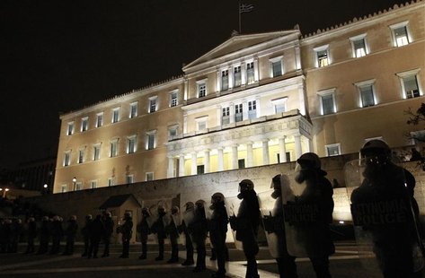 Riot police stand guard in front of the parliament during a protest against austerity measures in Athens Riot police stand guard in front of the parliament during a protest against austerity measures in Athens