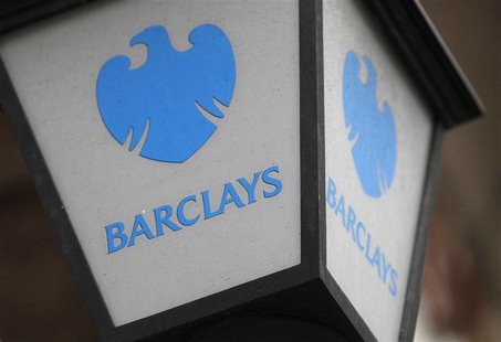 A lamp featuring a logo of Barclay's bank is seen outside a branch in London