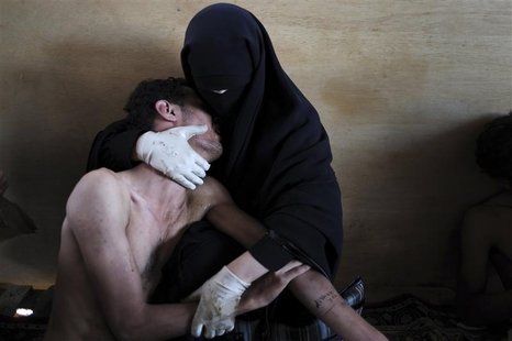 Aranda of Spain has won World Press Photo of the Year 2011 with this picture of woman holding wounded relative during protests against presi Aranda of Spain has won World Press Photo of the Year 2011 with this picture of woman holding wounded relative during protests against presi