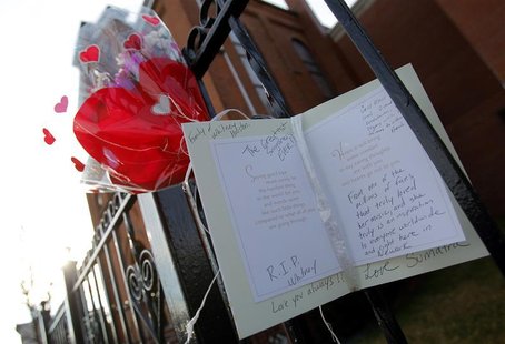 Flowers and a card are seen left as a memorial to deceased singer Whitney Houston, in front of the New Hope Baptist Church in New Jersey Flowers and a card are seen left as a memorial to deceased singer Whitney Houston, in front of the New Hope Baptist Church in New Jersey