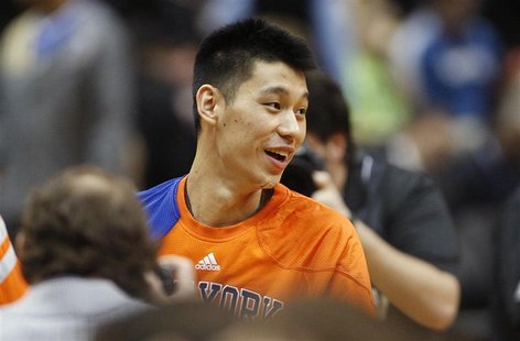Knicks guard Lin smiles during player introductions before the start of the Knicks' NBA basketball game against the Timberwolves in Minneapo Knicks guard Lin smiles during player introductions before the start of the Knicks' NBA basketball game against the Timberwolves in Minneapo