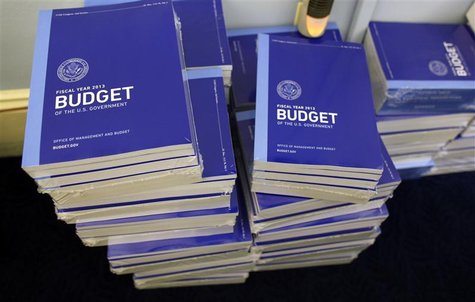 Copies of U.S. President Barack Obama's Fiscal Year 2013 budget are seen stacked inside the House Budget Committee room on Capitol Hill in W Copies of U.S. President Barack Obama's Fiscal Year 2013 budget are seen stacked inside the House Budget Committee room on Capitol Hill in W