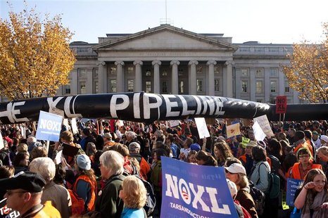 Demonstrators carry a giant mock pipeline while calling for the cancellation of the Keystone XL pipeline during a rally in Washington Demonstrators carry a giant mock pipeline while calling for the cancellation of the Keystone XL pipeline during a rally in Washington