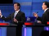 Republican presidential candidates Santorum and Romney discuss a point during a Republican presidential candidates debate in Myrtle Beach
