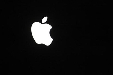 The Apple Inc corporate logo is pictured on rear side of the Macbook Pro notebook computer The Apple Inc corporate logo is pictured on rear side of the Macbook Pro notebook computer