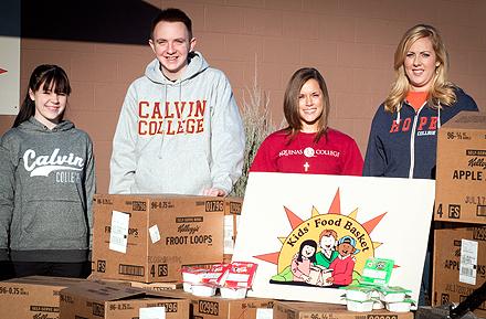 Students from Hope, Calvin and Aquinas colleges who participated in "Share The Bowl" campaign in which Kellogg's donated 228 cases of cereal to West Michigan food banks. Students from Hope, Calvin and Aquinas colleges who participated in "Share The Bowl" campaign in which Kellogg's donated 228 cases of cereal to West Michigan food banks.