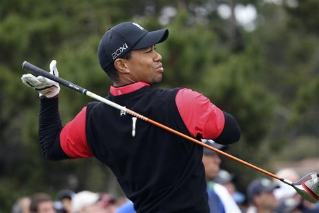 Woods drops his driver while teeing off on the 10th hole during the final round of the Pebble Beach National Pro-Am Woods drops his driver while teeing off on the 10th hole during the final round of the Pebble Beach National Pro-Am