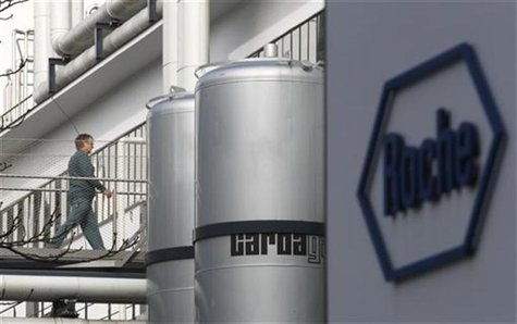A worker makes its way on a bridge at Swiss pharmaceutical company Roche plant in Basel A worker makes its way on a bridge at Swiss pharmaceutical company Roche plant in Basel
