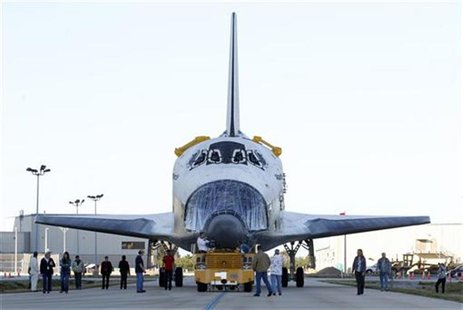 The space shuttle Atlantis is moved towards the huge Vertical Assembly Building for work in its decommissioning at the Kennedy Space Center The space shuttle Atlantis is moved towards the huge Vertical Assembly Building for work in its decommissioning at the Kennedy Space Center