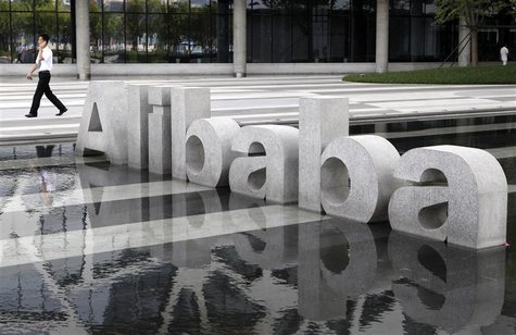A man walks past a logo of Alibaba (China) Technology Co. Ltd at its headquarters on the outskirts of Hangzhou A man walks past a logo of Alibaba (China) Technology Co. Ltd at its headquarters on the outskirts of Hangzhou