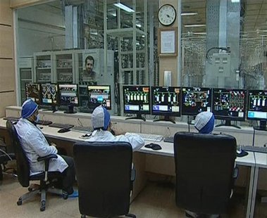 Still image taken from video shows workers in what is described by Iranian state television as an enrichment control room at a facility in N Still image taken from video shows workers in what is described by Iranian state television as an enrichment control room at a facility in N
