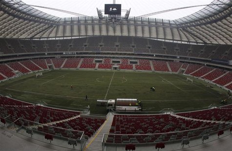 Construction workers lay the pitch of the National Stadium for the friendly opening match between Poland and Portugal, in Warsaw Construction workers lay the pitch of the National Stadium for the friendly opening match between Poland and Portugal, in Warsaw