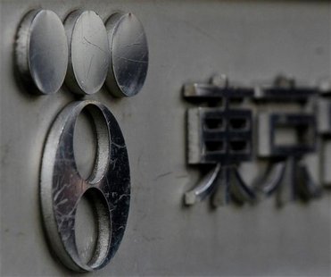 Scratches are seen on the logo of Tepco, the operator of the Fukushima Daiichi nuclear power plant, at the company's headquarters in Tokyo Scratches are seen on the logo of Tepco, the operator of the Fukushima Daiichi nuclear power plant, at the company's headquarters in Tokyo