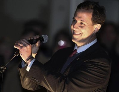 Republican presidential candidate Rick Santorum smiles while speaking to the crowd at a campaign rally at the Washington State History Museu Republican presidential candidate Rick Santorum smiles while speaking to the crowd at a campaign rally at the Washington State History Museu