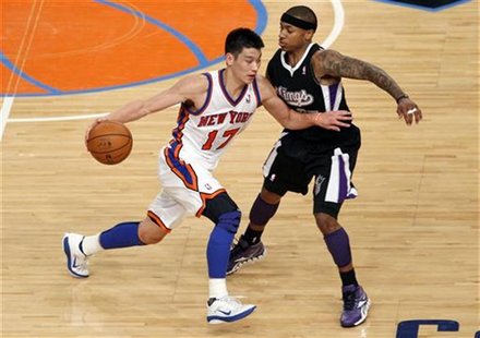 Knicks' Lin drives into Kings' Thomas during third quarter of their NBA basketball game in New York Knicks' Lin drives into Kings' Thomas during third quarter of their NBA basketball game in New York