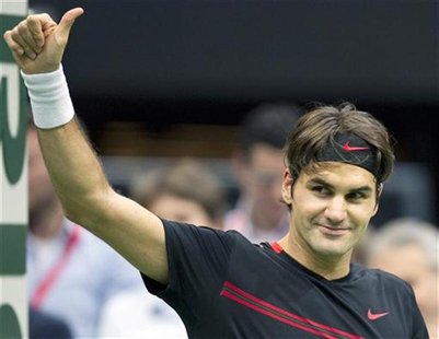 Federer of Switzerland reacts after match point against Nieminen of Finland during their men's singles tennis match at the World Indoor Tour Federer of Switzerland reacts after match point against Nieminen of Finland during their men's singles tennis match at the World Indoor Tour