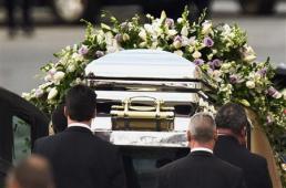 Pall-bearers load the casket of pop singer Whitney Houston into a hearse following her funeral service at the New Hope Baptist Church in Newark, New Jersey February 18, 2012. Houston, 48, died in a Beverly Hills hotel room on February 11, the eve of the music industry's Grammy Awards. REUTERS/Lucas Jackson Pall-bearers load the casket of pop singer Whitney Houston into a hearse following her funeral service at the New Hope Baptist Church in Newark, New Jersey February 18, 2012. Houston, 48, died in a Beverly Hills hotel room on February 11, the eve of the music industry's Grammy Awards. REUTERS/Lucas Jackson