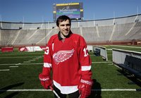 Detroit Red Wings player Pavel Datsyuk stands on the field at Michigan Stadium in Ann Arbor