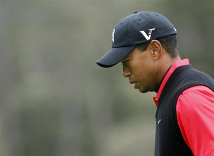 Woods reacts after missing birdie on the 13th hole during the final round of the Pebble Beach National Pro-Am