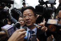 Xie, a lawyer representing Proview Technology (Shenzhen), speaks to reporters in front of the Shanghai Pudong New Area People's Court