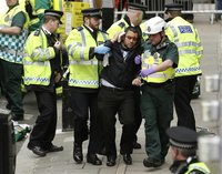 Police, fire and ambulance crews participate in a drill in the event of a terrorist attack during the Olympic games, at a disused undergroun