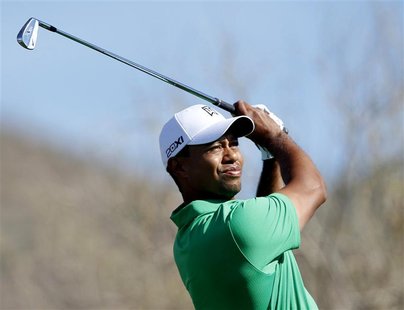 Tiger Woods of the U.S. watches his tee shot on the third hole during the first round of the WGC-Accenture Matchplay Championships golf tour Tiger Woods of the U.S. watches his tee shot on the third hole during the first round of the WGC-Accenture Matchplay Championships golf tour