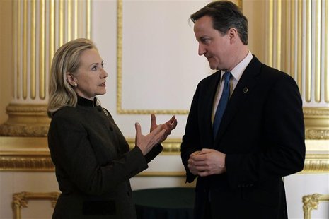 Britain's Prime Minister David Cameron speaks with US Secretary of State Hillary Clinton during the Somalia Conference at Lancaster House in Britain's Prime Minister David Cameron speaks with US Secretary of State Hillary Clinton during the Somalia Conference at Lancaster House in