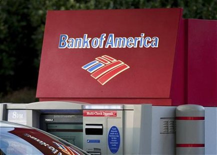 A Bank of America customer uses an ATM machine at a branch in Greenville A Bank of America customer uses an ATM machine at a branch in Greenville