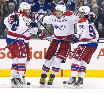 Washington Capitals Alex Ovechkin and Marcus Johansson celebrate a goal scored by Keith Aucoin in their NHL hockey game against Toronto Mapl Washington Capitals Alex Ovechkin and Marcus Johansson celebrate a goal scored by Keith Aucoin in their NHL hockey game against Toronto Mapl