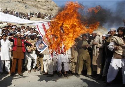 Afghan protesters burn a U.S. flag during a protest in Jalalabad province February 24, 2012.
REUTERS/Parwiz Afghan protesters burn a U.S. flag during a protest in Jalalabad province February 24, 2012.
REUTERS/Parwiz
