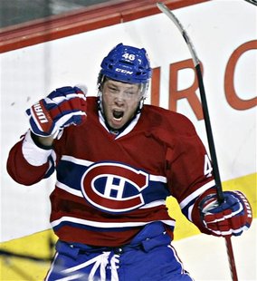 Canadiens Kostitsyn celebrates goal on Islanders' Montoya during first period NHL hockey action in Montreal Canadiens Kostitsyn celebrates goal on Islanders' Montoya during first period NHL hockey action in Montreal