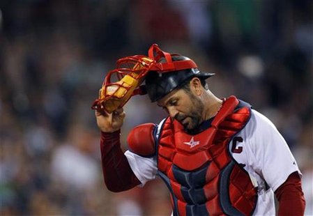Boston Red Sox catcher Jason Varitek walks back to the dugout at the end of the ninth inning of their MLB American League baseball game agai Boston Red Sox catcher Jason Varitek walks back to the dugout at the end of the ninth inning of their MLB American League baseball game agai