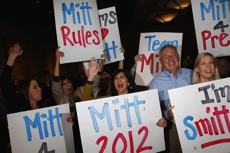 Supporters of U.S. Republican presidential candidate and former Massachusetts Governor Mitt Romney hold signs while they cheer as Romney win Supporters of U.S. Republican presidential candidate and former Massachusetts Governor Mitt Romney hold signs while they cheer as Romney win