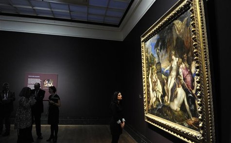 A staff member poses in front of Titian's painting 'Diana and Callisto' at the National Gallery in London A staff member poses in front of Titian's painting 'Diana and Callisto' at the National Gallery in London