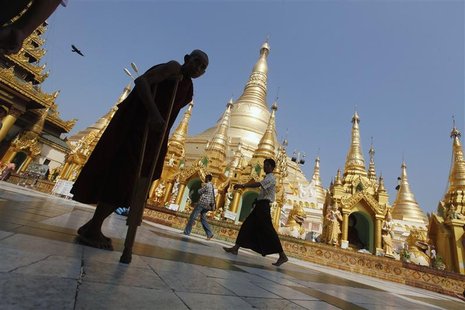 A disabled Buddhist monk walks on the grounds of Shwedagon Pagoda during the 2,600th anniversary of the pagoda in Yangon A disabled Buddhist monk walks on the grounds of Shwedagon Pagoda during the 2,600th anniversary of the pagoda in Yangon