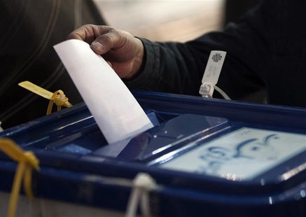 Iranian man casts his vote during Iran's parliamentary election in Tehran Iranian man casts his vote during Iran's parliamentary election in Tehran