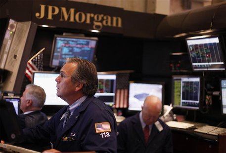 Traders work in the JP Morgan company stall on the floor of the New York Stock Exchange in New York Traders work in the JP Morgan company stall on the floor of the New York Stock Exchange in New York
