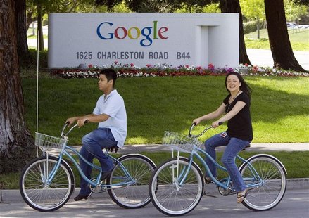 People ride their bikes past Google Inc. headquarters in Mountain View People ride their bikes past Google Inc. headquarters in Mountain View