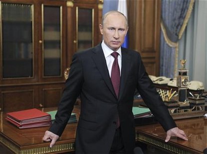 Russian PM Vladimir Putin looks on during his televised speech to address Russian citizens in Moscow Russian PM Vladimir Putin looks on during his televised speech to address Russian citizens in Moscow