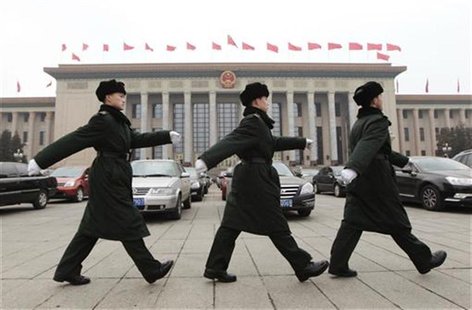 Soldiers of the PLA march in front of the Great Hall of the People in Beijing Soldiers of the PLA march in front of the Great Hall of the People in Beijing