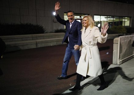 Republican presidential candidate and former Massachusetts Governor Mitt Romney waves with his wife Ann as they leave a campaign rally at Th Republican presidential candidate and former Massachusetts Governor Mitt Romney waves with his wife Ann as they leave a campaign rally at Th