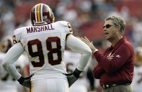 Washington Redskins defensive coach Williams talks to Lemar Marshall prior to their NFL game in Landover, Maryland Washington Redskins defensive coach Williams talks to Lemar Marshall prior to their NFL game in Landover, Maryland