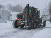 grader plowing snow grader plowing snow