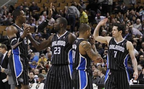 Magic's Howard, Richardson, Nelson, and Redick celebrate against the Raptors during their NBA basketball game in Toronto Magic's Howard, Richardson, Nelson, and Redick celebrate against the Raptors during their NBA basketball game in Toronto