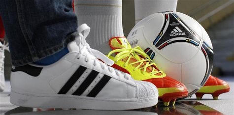 Different shoes and soccer ball by German sporting goods maker are pictured before annual news conference in Herzogenaurach Different shoes and soccer ball by German sporting goods maker are pictured before annual news conference in Herzogenaurach