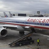 A worker walks underneath an American Airlines airplane at Miami International airport in Miami, Florida A worker walks underneath an American Airlines airplane at Miami International airport in Miami, Florida