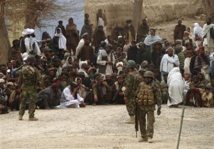 Afghan National Army soldiers keep watch as Afghans gather outside a U.S. base in Panjwai district Kandahar province, March 11, 2012.
REUTERS/Ahmad Nadeem Afghan National Army soldiers keep watch as Afghans gather outside a U.S. base in Panjwai district Kandahar province, March 11, 2012.
REUTERS/Ahmad Nadeem