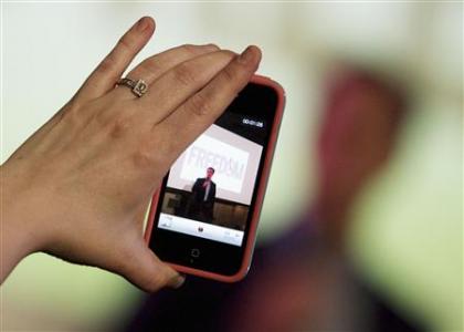 A woman takes a video with her iPhone as Republican presidential candidate and former U.S. Senator Rick Santorum addresses supporters at a Get Out The Vote rally in Mandeville, Louisiana March 21, More...
Credit: REUTERS/Sean Gardner A woman takes a video with her iPhone as Republican presidential candidate and former U.S. Senator Rick Santorum addresses supporters at a Get Out The Vote rally in Mandeville, Louisiana March 21, More...
Credit: REUTERS/Sean Gardner