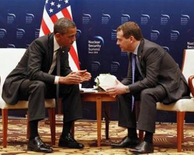 U.S. President Barack Obama (L) speaks to Russian President Dmitry Medvedev in a bilateral meeting before attending the 2012 Nuclear Security Summit in Seoul March 26, 2012. REUTERS/Larry Downing U.S. President Barack Obama (L) speaks to Russian President Dmitry Medvedev in a bilateral meeting before attending the 2012 Nuclear Security Summit in Seoul March 26, 2012. REUTERS/Larry Downing