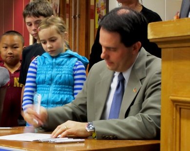Governor Walker signs education reform into law. Governor Walker signs education reform into law.